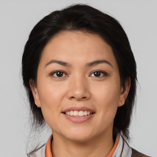 Joyful white young-adult female with medium  brown hair and brown eyes