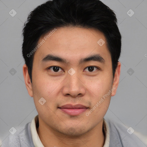 Joyful asian young-adult male with short  black hair and brown eyes