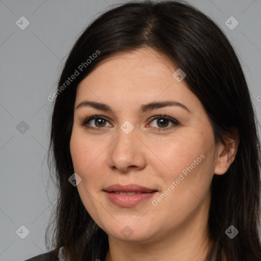 Joyful white young-adult female with long  brown hair and brown eyes