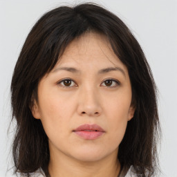 Neutral asian young-adult female with medium  brown hair and brown eyes