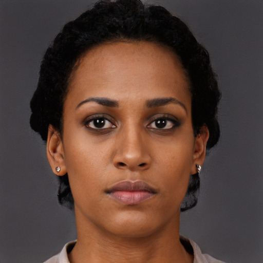 Neutral black young-adult female with short  black hair and brown eyes