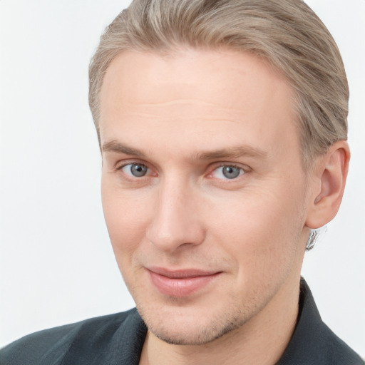 Joyful white adult male with short  brown hair and grey eyes