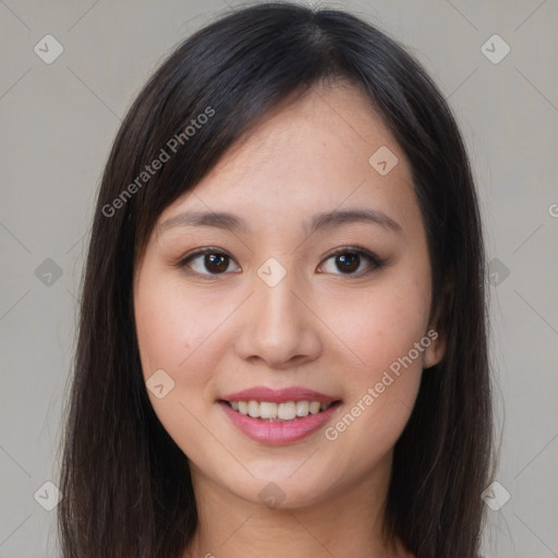 Joyful asian young-adult female with long  brown hair and brown eyes