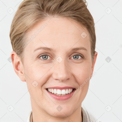 Joyful white young-adult female with short  brown hair and grey eyes