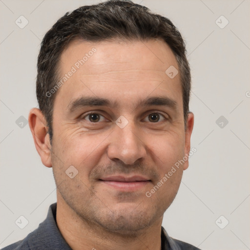 Joyful white adult male with short  brown hair and brown eyes