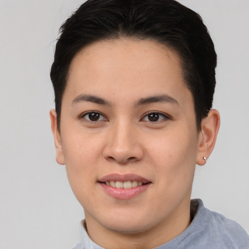 Joyful asian young-adult female with short  brown hair and brown eyes