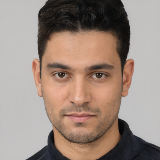 Neutral white young-adult male with short  black hair and brown eyes