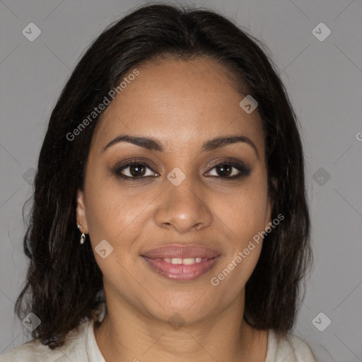 Joyful black young-adult female with medium  brown hair and brown eyes