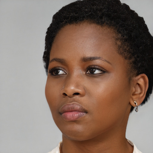 Neutral black young-adult female with short  black hair and brown eyes