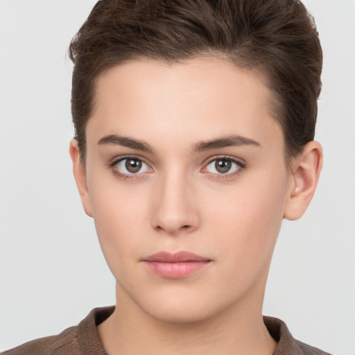 Neutral white young-adult female with short  brown hair and brown eyes