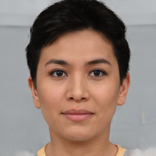 Joyful asian young-adult female with short  brown hair and brown eyes