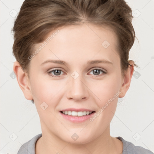 Joyful white young-adult female with short  brown hair and grey eyes