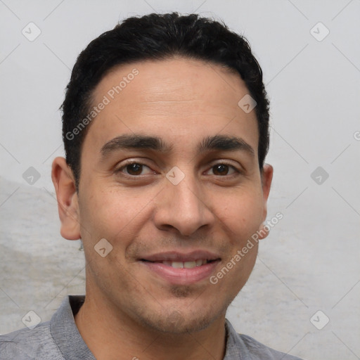 Joyful white young-adult male with short  black hair and brown eyes