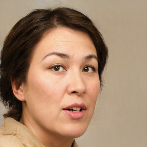 Joyful white adult female with medium  brown hair and brown eyes