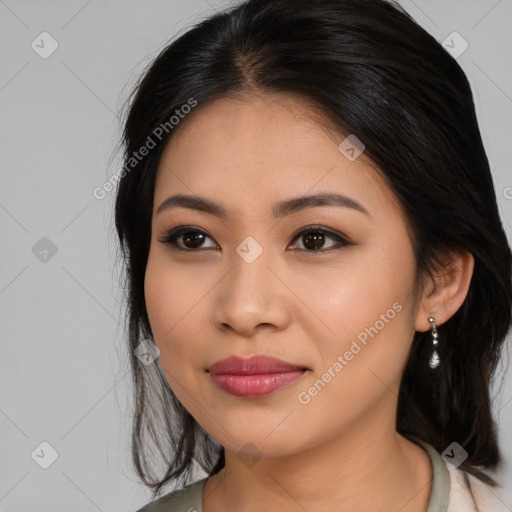 Joyful asian young-adult female with long  brown hair and brown eyes