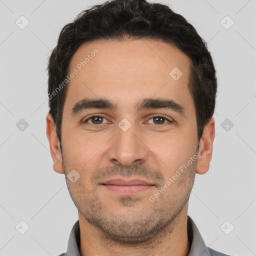 Joyful white young-adult male with short  black hair and brown eyes