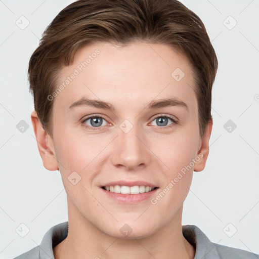 Joyful white young-adult female with short  brown hair and grey eyes