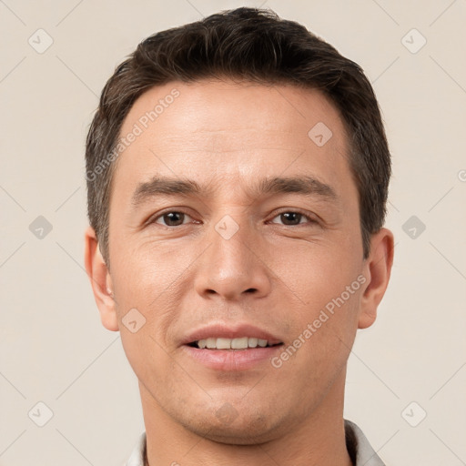 Joyful white young-adult male with short  brown hair and brown eyes