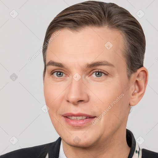 Joyful white adult male with short  brown hair and brown eyes