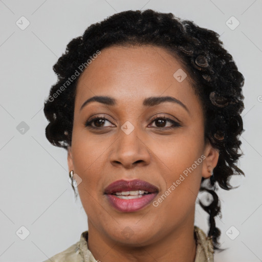 Joyful black young-adult female with long  brown hair and brown eyes