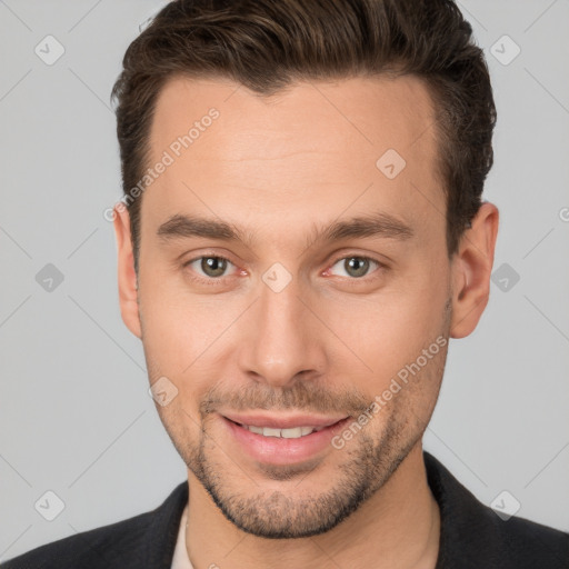 Joyful white young-adult male with short  brown hair and brown eyes