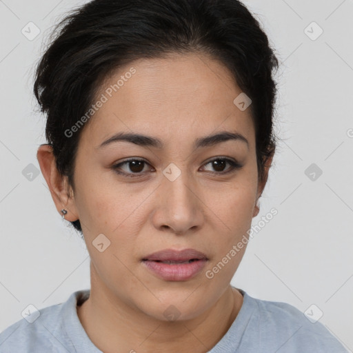 Joyful latino young-adult female with short  brown hair and brown eyes