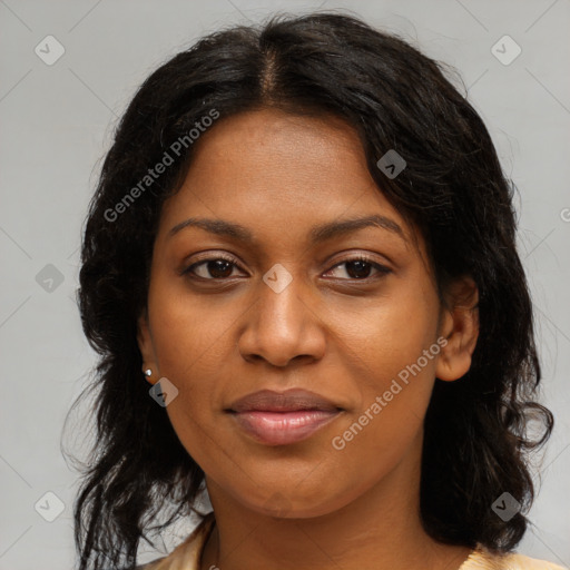 Joyful black young-adult female with long  brown hair and brown eyes