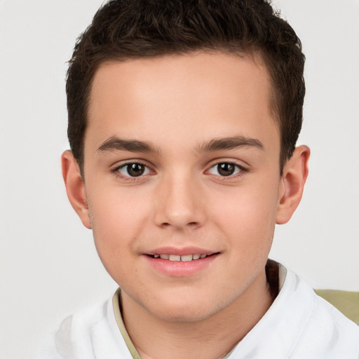 Joyful white child male with short  brown hair and brown eyes