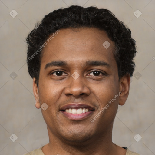 Joyful latino young-adult male with short  black hair and brown eyes