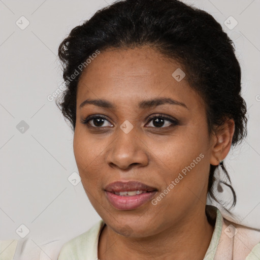 Joyful black young-adult female with medium  brown hair and brown eyes