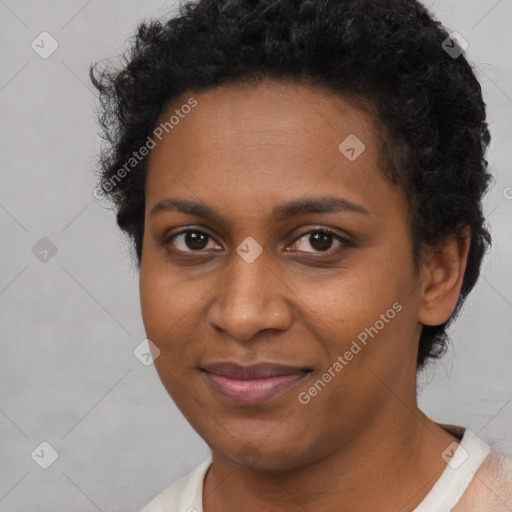 Joyful black young-adult female with short  brown hair and brown eyes