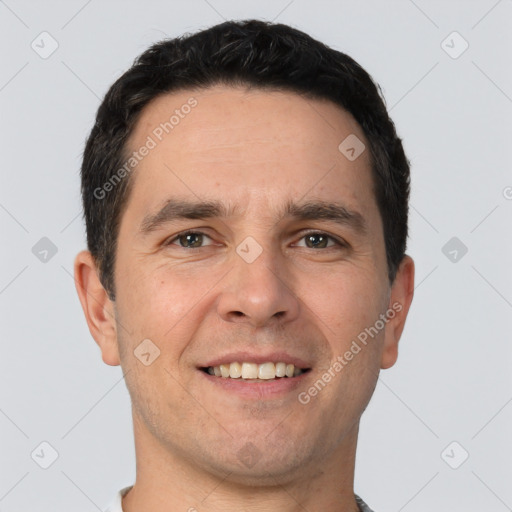 Joyful white young-adult male with short  black hair and brown eyes