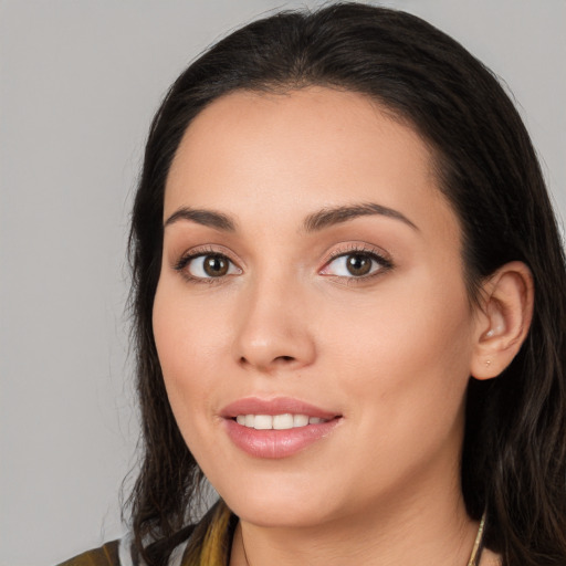 Joyful white young-adult female with long  black hair and brown eyes