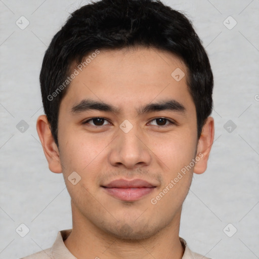 Joyful asian young-adult male with short  brown hair and brown eyes