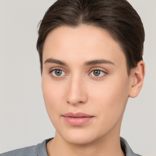 Neutral white young-adult female with short  brown hair and brown eyes