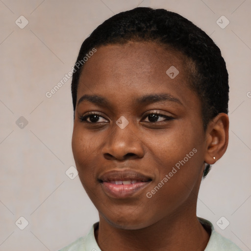 Joyful black young-adult female with short  black hair and brown eyes