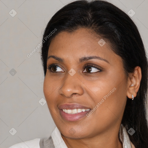 Joyful black young-adult female with medium  brown hair and brown eyes