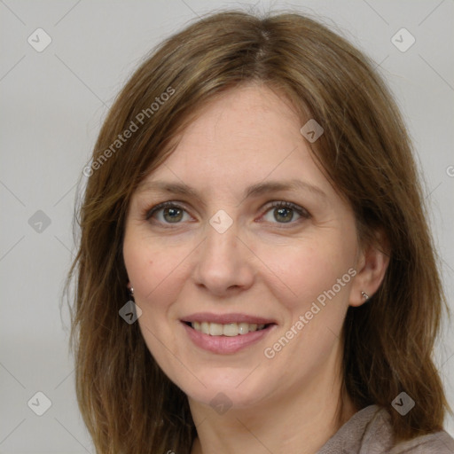 Joyful white adult female with medium  brown hair and grey eyes