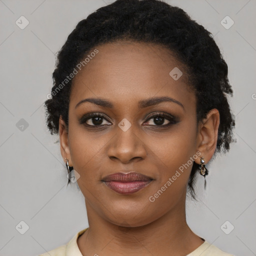 Joyful black young-adult female with short  black hair and brown eyes