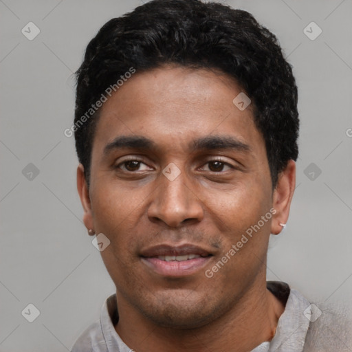 Joyful latino young-adult male with short  black hair and brown eyes