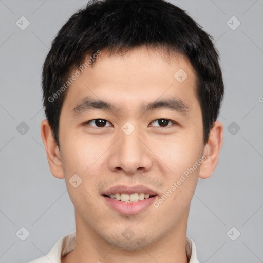 Joyful asian young-adult male with short  brown hair and brown eyes