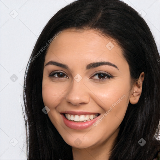 Joyful latino young-adult female with long  brown hair and brown eyes