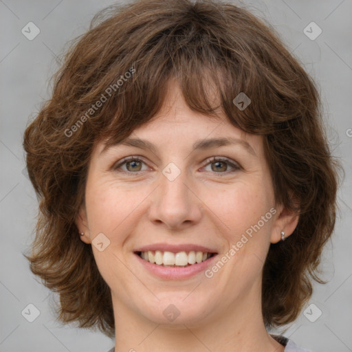 Joyful white young-adult female with medium  brown hair and green eyes