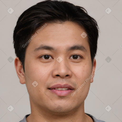 Joyful asian young-adult male with short  brown hair and brown eyes