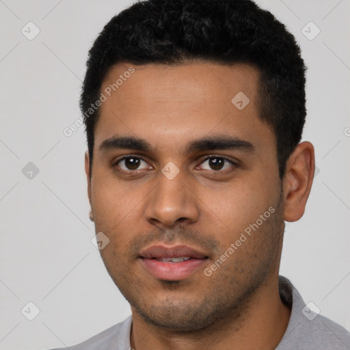 Neutral latino young-adult male with short  black hair and brown eyes