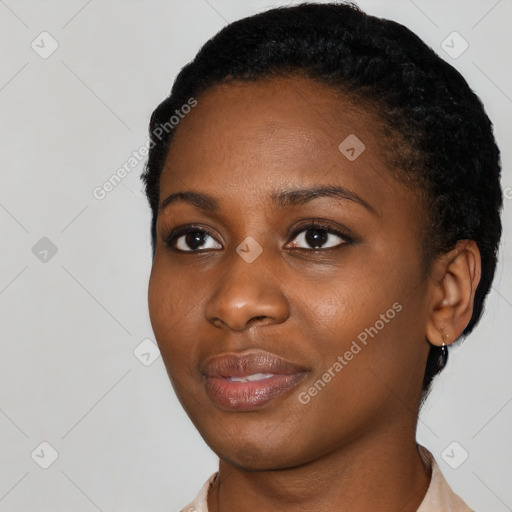 Joyful black young-adult female with short  black hair and brown eyes