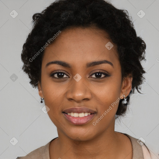 Joyful black young-adult female with long  black hair and brown eyes