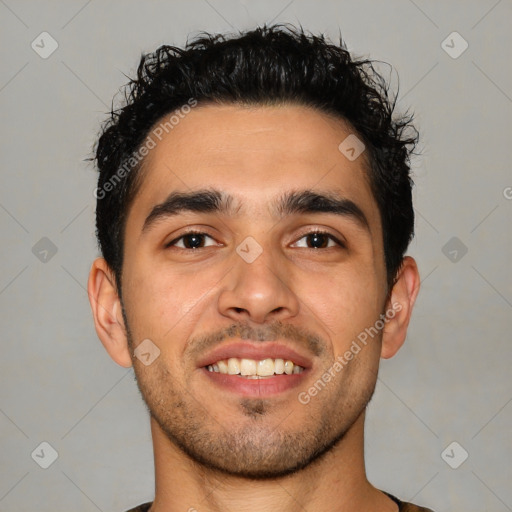 Joyful latino young-adult male with short  black hair and brown eyes