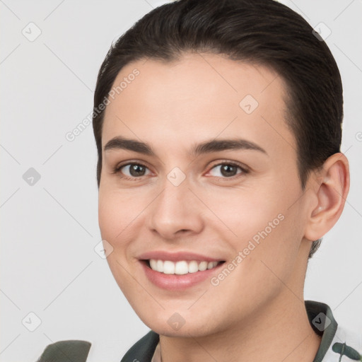 Joyful white young-adult female with short  brown hair and brown eyes