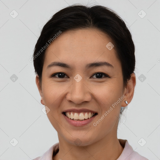 Joyful asian young-adult female with short  brown hair and brown eyes